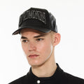 Hvman Logo Mesh Trucker Hat in Black Faux Leather