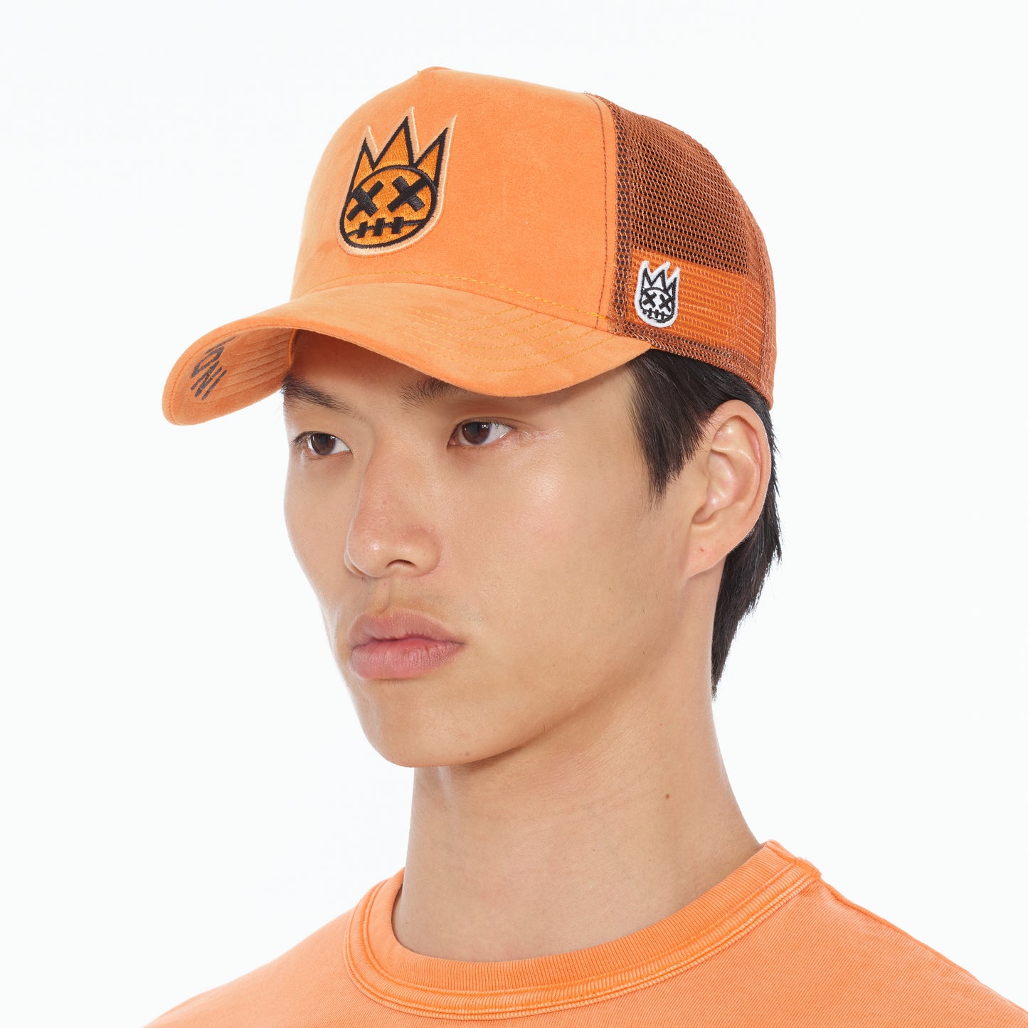 Cult's Clean Logo Mesh Back Trucker Hat in Orange