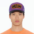 Cult's "May The Bridges I Burn" Mesh Back Trucker Hat in Purple