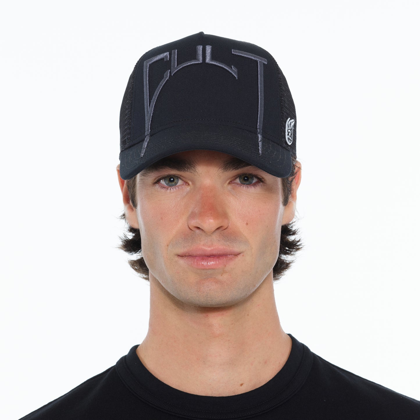 Cult's Arch Logo Mesh Back Trucker Hat in Black