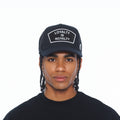 Cult's Mesh Back Trucker Hat "Loyalty Is Royalty" In Black