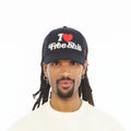 Cult's Mesh Back Trucker Hat "I Love Free Shit" In Black
